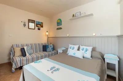 Letto o letti in una camera di Mishti Blu Studio al Mare by Wonderful Italy