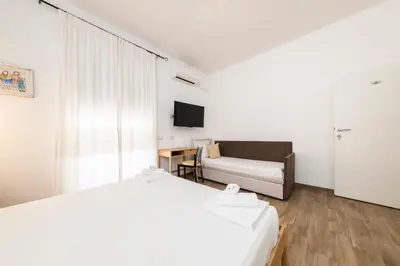 Letto o letti in una camera di NG Collection l'Acquedotto