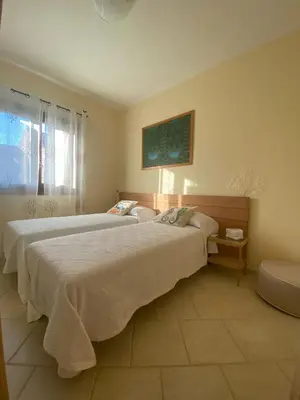 Letto o letti in una camera di La Perlacea fronte mare