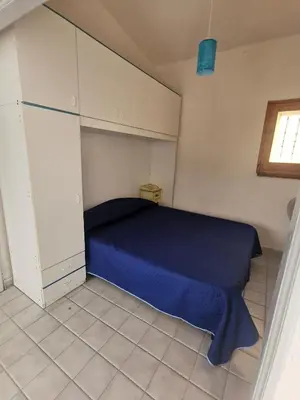 Letto o letti in una camera di La Conchiglia di Porto Ottiolu