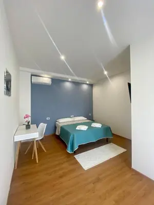 Letto o letti in una camera di Zulie Rooms