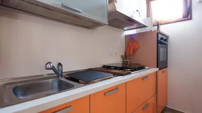 Cucina o angolo cottura di Welcomely - Petali di Rosa - A Due Passi dalla Spiaggia