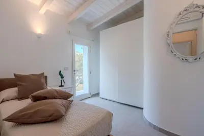 Letto o letti in una camera di Villa DEG Vista Mare San Teodoro Puntaldia