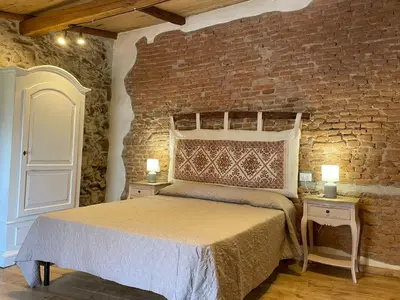 Letto o letti in una camera di Antica Dimora Fora e' Muros AMMENTOS POSADA
