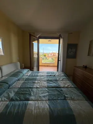 Letto o letti in una camera di Olbia - accogliente casa vicina al centro e spiagge