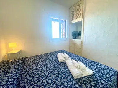 Letto o letti in una camera di San Teodoro PUNTA EST Vista Mare