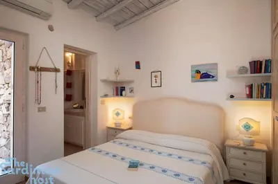 Letto o letti in una camera di Tavolara House-family relax