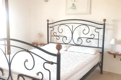 Letto o letti in una camera di Villa Lentischio