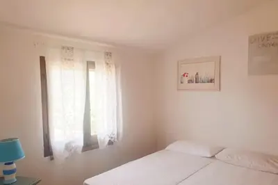 Letto o letti in una camera di Villa Lentischio
