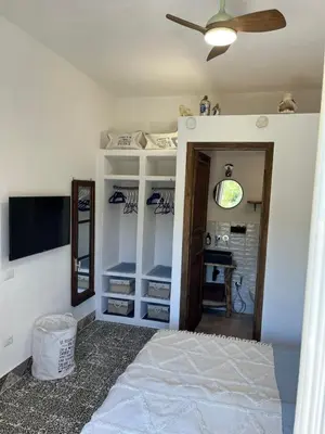 Letto o letti in una camera di B&B San Gavino