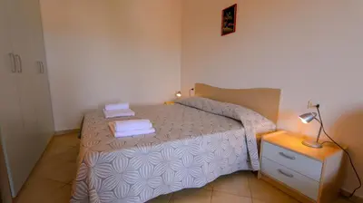 Letto o letti in una camera di Appartamento Aquaro