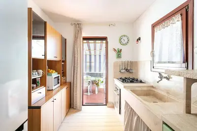 Cucina o angolo cottura di VILLA Piera SOS ARANZOS -Golfo Aranci Sea View-