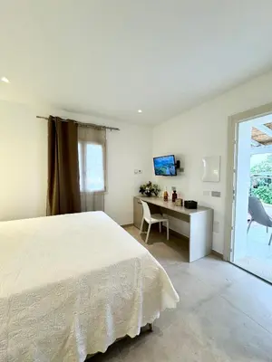 Letto o letti in una camera di Villa Berenike