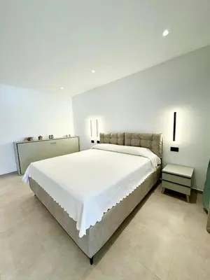 Letto o letti in una camera di Villa Berenike