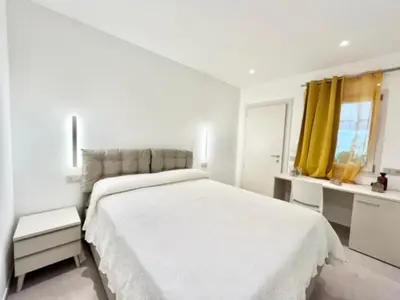 Letto o letti in una camera di Villa Berenike