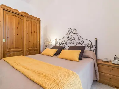 Letto o letti in una camera di Villa il Carrubo
