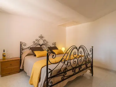 Letto o letti in una camera di Villa il Carrubo