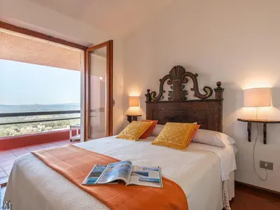 Letto o letti in una camera di Villa Billia Sardinia Domus