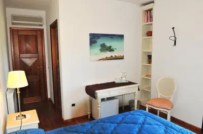 Letto o letti in una camera di Villa Geron