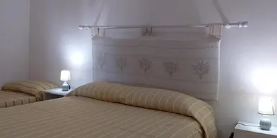 Letto o letti in una camera di Casa Marconi