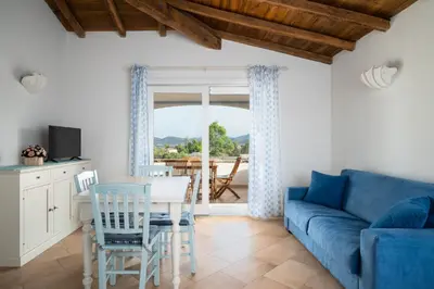 Area soggiorno di Villa Olive by Klodge
