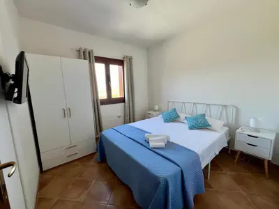 Letto o letti in una camera di Villa Sunrise