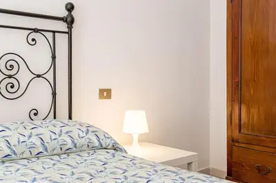 Letto o letti in una camera di Palm Garden House - Cala Gonone