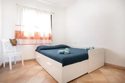 Letto o letti in una camera di Casina Maria