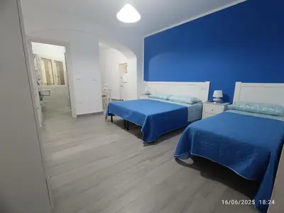 Letto o letti in una camera di Casa Iole
