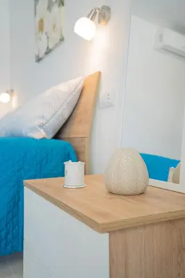 Letto o letti in una camera di AMBRA Holiday Rooms - Rooms & Beach