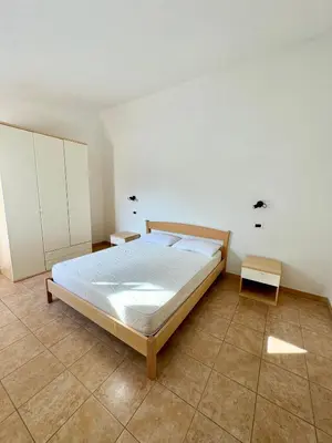 Letto o letti in una camera di Case vacanza Corallo - San Teodoro centro