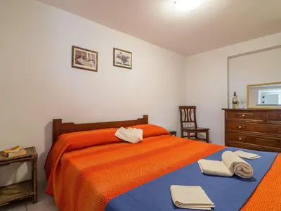Letto o letti in una camera di Casa a 150 m Dalla Spiaggia