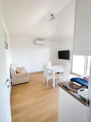 TV o dispositivi per l'intrattenimento presso Olbia Mare Luxury Apartment