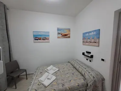 Letto o letti in una camera di Maristella