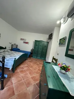 Letto o letti in una camera di B&B Il Glicine