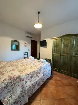 Letto o letti in una camera di B&B Il Glicine