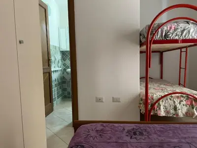 Letto o letti in una camera di BIG HOME ZAN01/02 · 4 bedrooms · 16 beds · 4 b