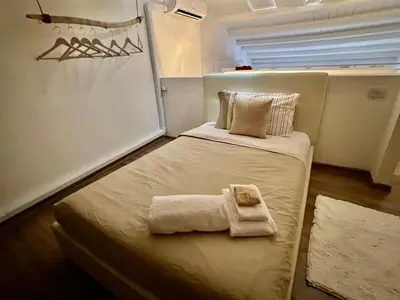 Letto o letti in una camera di Loft Porto Romano Olbia Centro