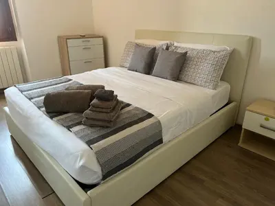 Letto o letti in una camera di Loft Porto Romano Olbia Centro
