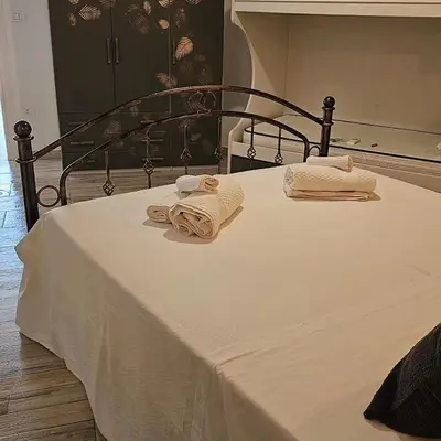Letto o letti in una camera di Giojas - Camera quadrupla in centro