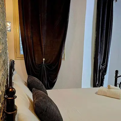 Letto o letti in una camera di Giojas - Camera quadrupla in centro