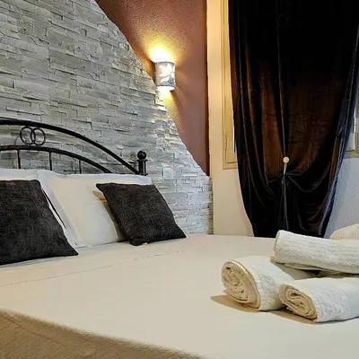 Letto o letti in una camera di Giojas - Camera quadrupla in centro