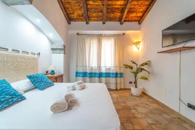 Letto o letti in una camera di PV9 by DomusAway