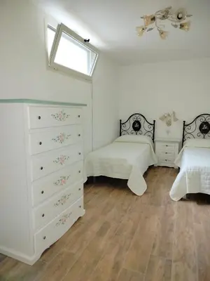 Letto o letti in una camera di Budoni Residence Lutturai 1