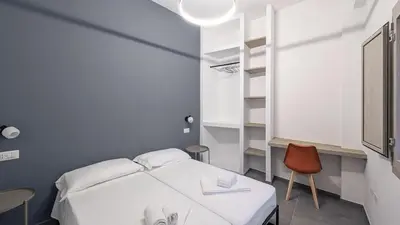 Letto o letti in una camera di DANTE3 - Appartamento moderno in centro