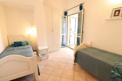 Letto o letti in una camera di Sardegna Appartamento panoramico cod IUN Q4795