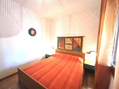 Letto o letti in una camera di Domo Diana