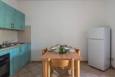 Cucina o angolo cottura di Simple Gem of Le Dimore di Budoni 1 Bedroom B4 Apartment sleeps 4
