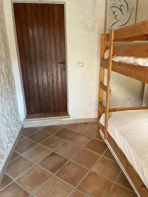 Letto o letti in una camera di House in Villaggio Nuragheddu