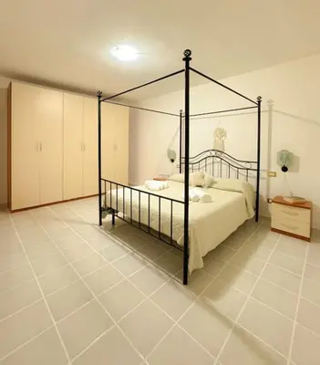 Letto o letti in una camera di Casa Elisa